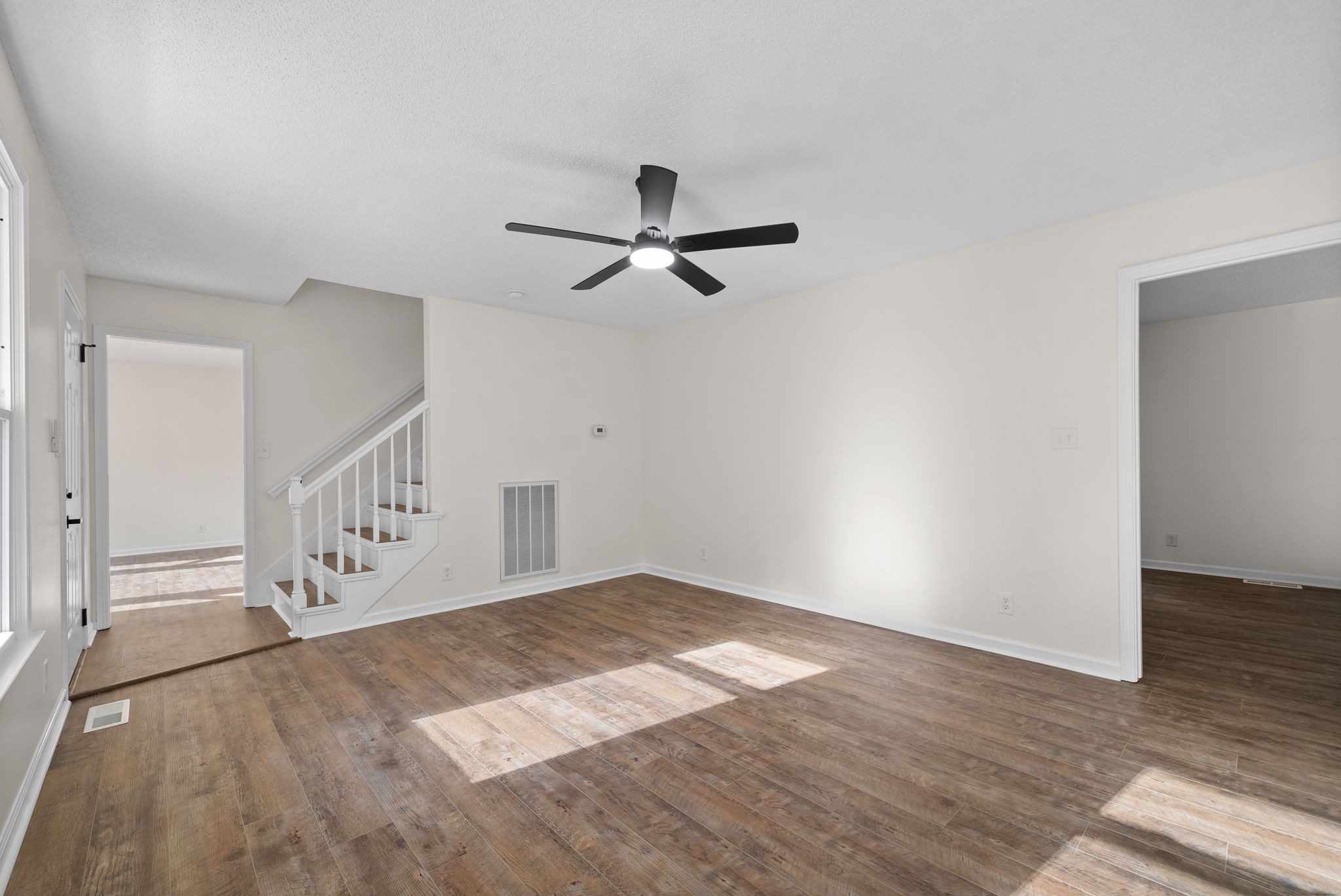 2212 Bend Road Clarksville, TN 37040 - Photo 6 of 32 wooden floor in an empty room with a window