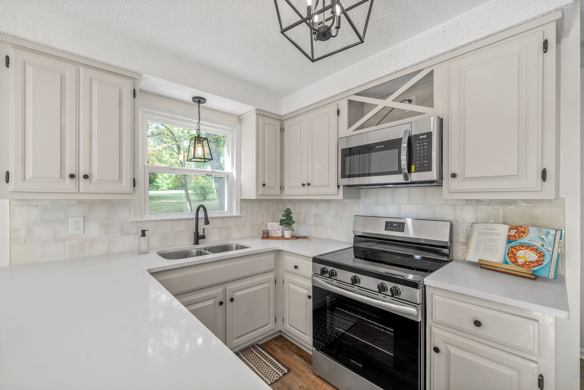 2212 Bend Road Clarksville, TN 37040 - Photo 8 of 32 a kitchen with stainless steel appliances white cabinets and a sink