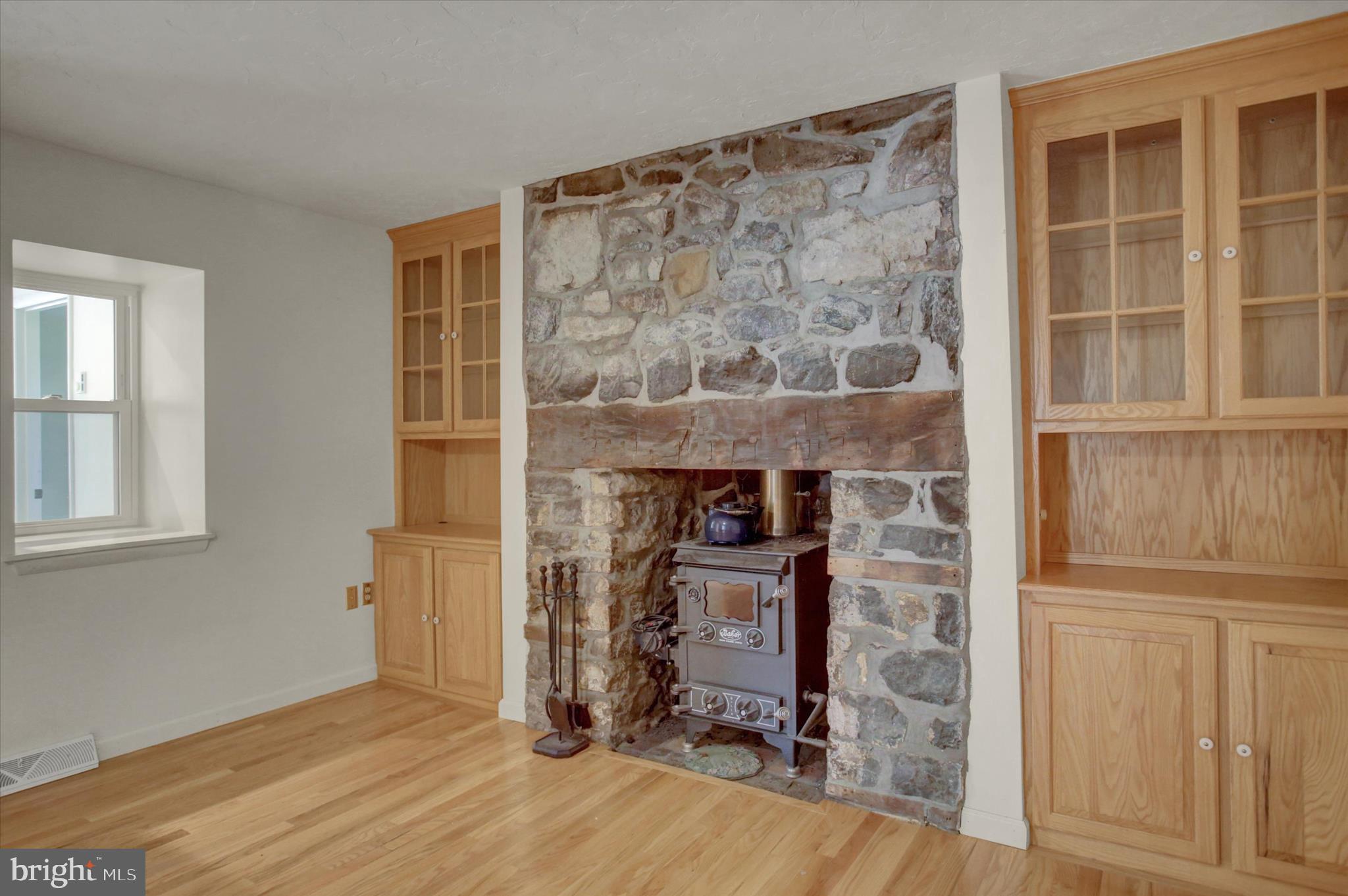 120 North Winding Road Wellsville, PA 17365 - Photo 25 of 66 Fireplace with Baker Wood Stove