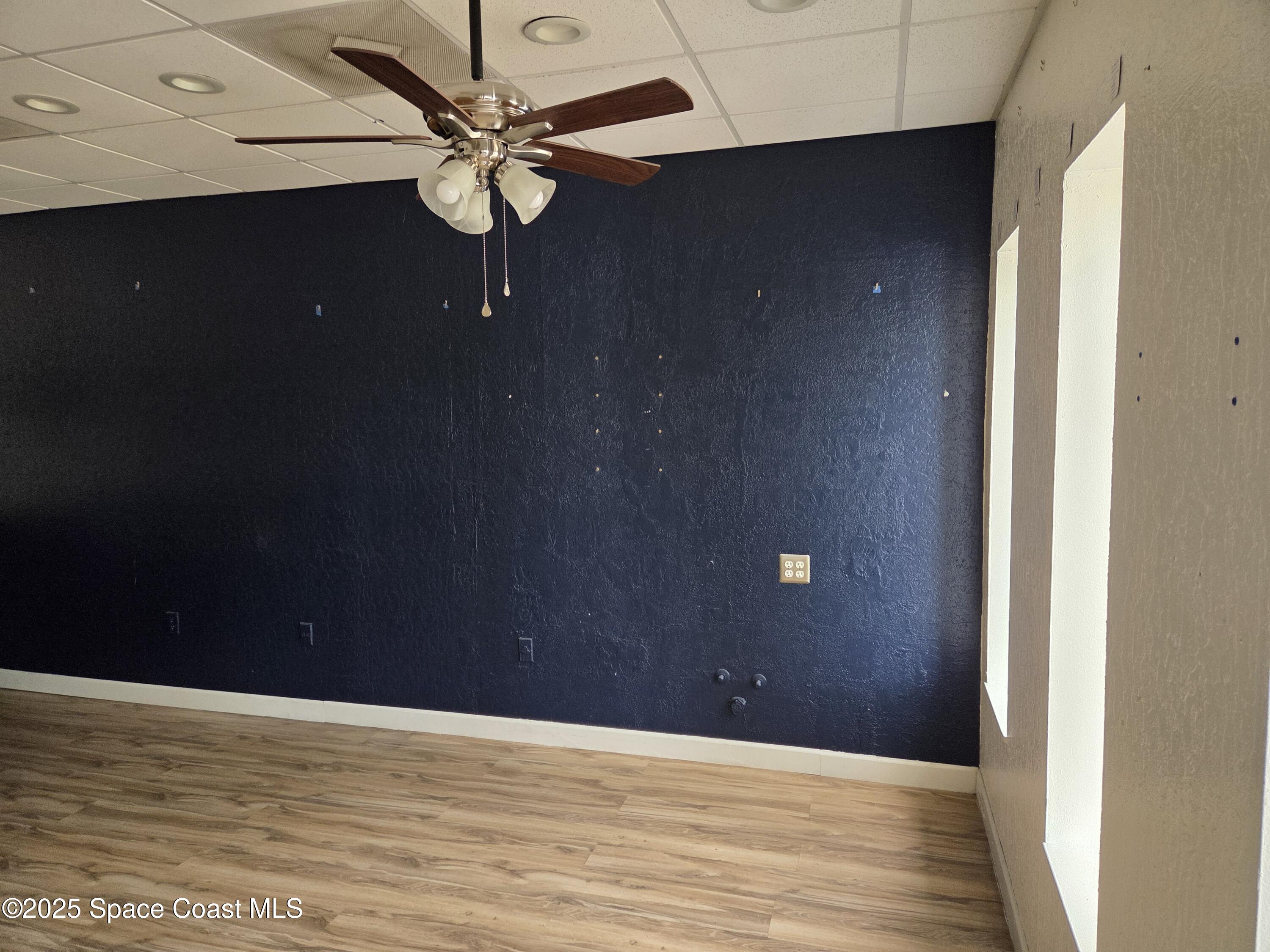 1707 Elm Street, Unit F Rockledge, FL 32955 - Photo 4 of 5 a view of an empty room with a window