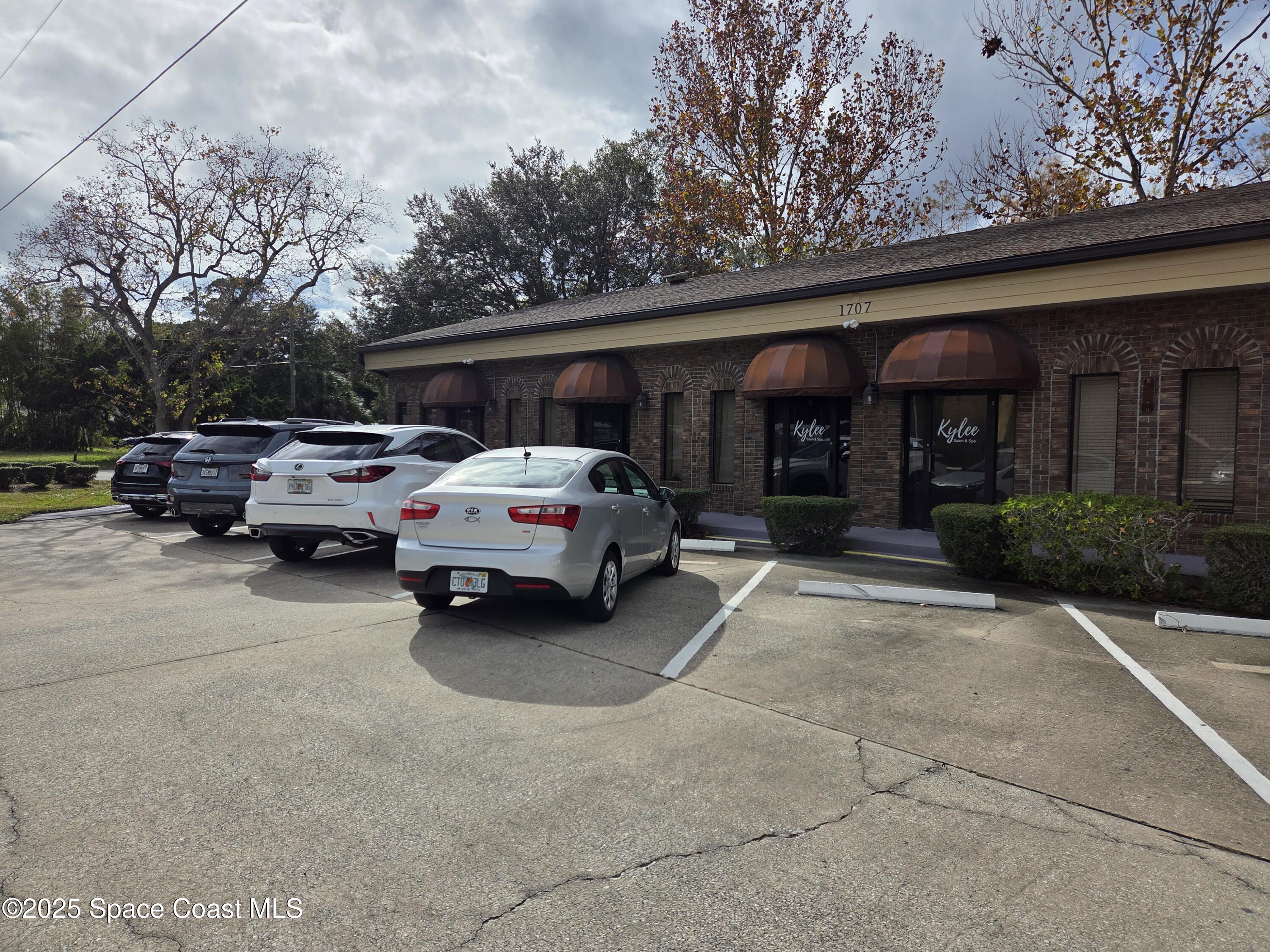 1707 Elm Street, Unit F Rockledge, FL 32955 - Photo 5 of 5 a car parked in front of a building