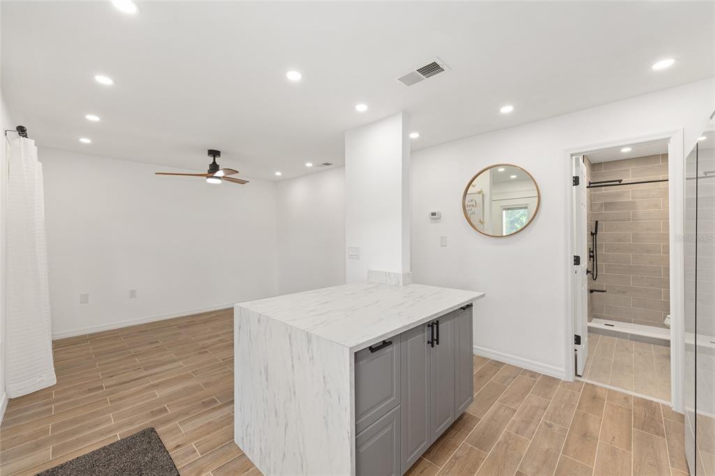 2437 Northeast 6th Street, Unit 14 Ocala, FL 34470 - Photo 15 of 22 a view of a hallway to a room with wooden floor