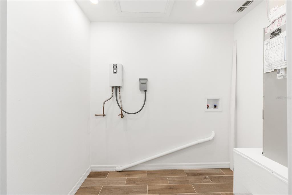 2437 Northeast 6th Street, Unit 14 Ocala, FL 34470 - Photo 20 of 22 a view of a room with racks on the wall