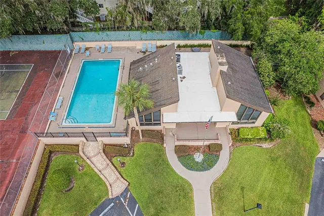 a aerial view of a house with pool