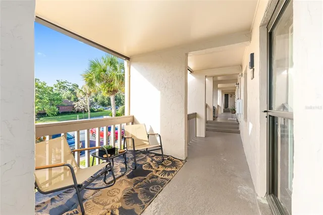 a view of an chairs and table in the balcony