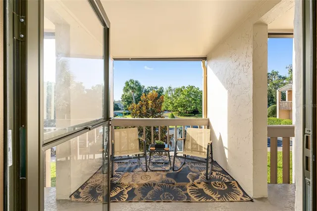 a view of an chairs and table in the balcony