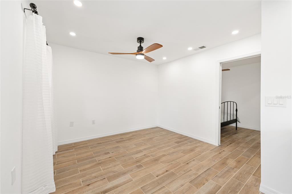 2437 Northeast 6th Street, Unit 14 Ocala, FL 34470 - Photo 9 of 22 a view of a room with a sink and a ceiling fan