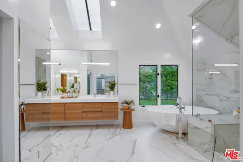 a bathroom with a bathtub and a sink