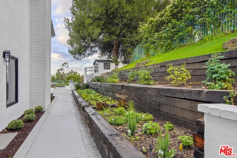 a view of a garden with an outdoor space