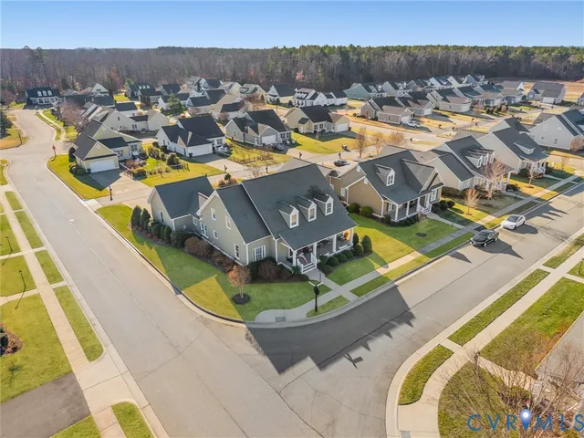 a living room with furniture a rug and a window