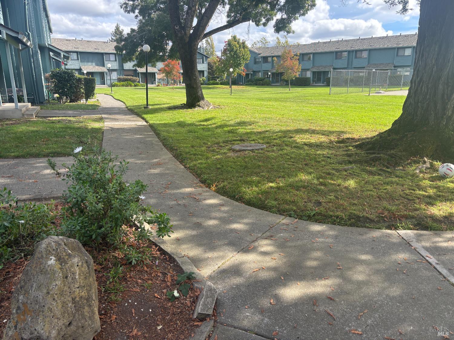 221 College View Drive Rohnert Park, CA 94928 - Photo 2 of 12 a view of a fountain in front of a house with a big yard
