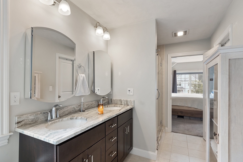 46 Jordan Road Holden, MA 01520 - Photo 20 of 42 a bathroom with a granite countertop sink and a mirror