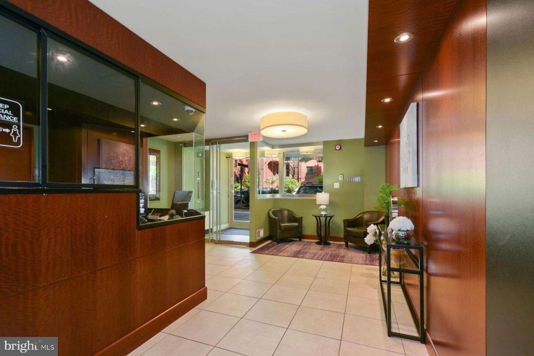 1260 21st Street Northwest, Unit 208 Washington, DC 20036 - Photo 20 of 25 a lobby with furniture and a potted plant
