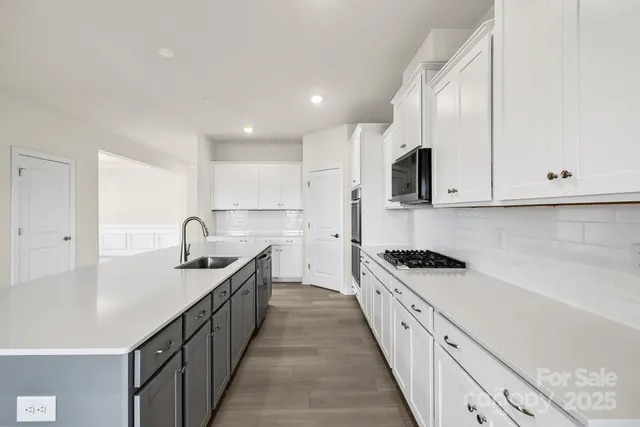 a large kitchen with cabinets