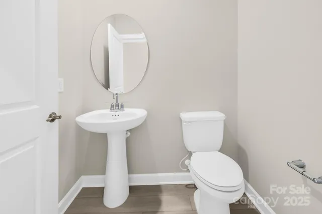 a bathroom with a shower sink and mirror