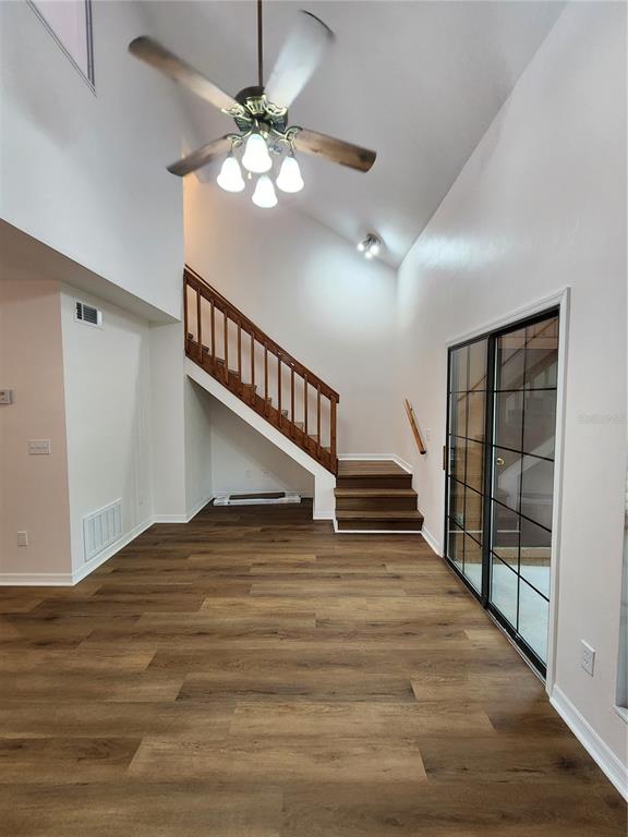 5823 Southwest 9th Place, Unit H55 Gainesville, FL 32607 - Photo 26 of 50 a view of entryway and hall with wooden floor