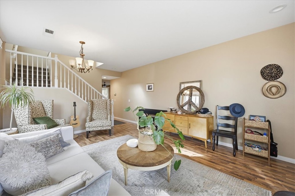 32623 Ritter Court Temecula, CA 92592 - Photo 13 of 40 a living room with furniture and a mirror