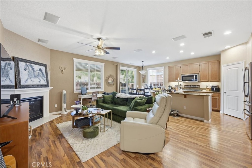 32623 Ritter Court Temecula, CA 92592 - Photo 15 of 40 a living room with lots of furniture kitchen view and a large window