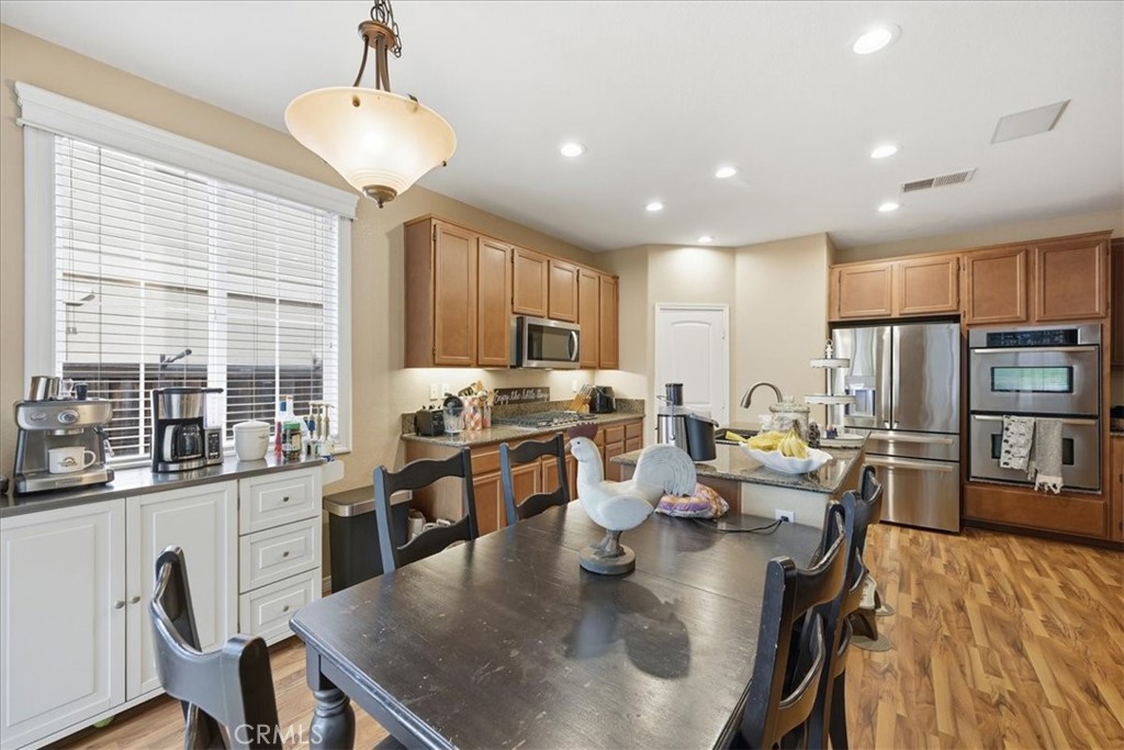 32623 Ritter Court Temecula, CA 92592 - Photo 16 of 40 a kitchen with lots of counter top space and stainless steel appliances