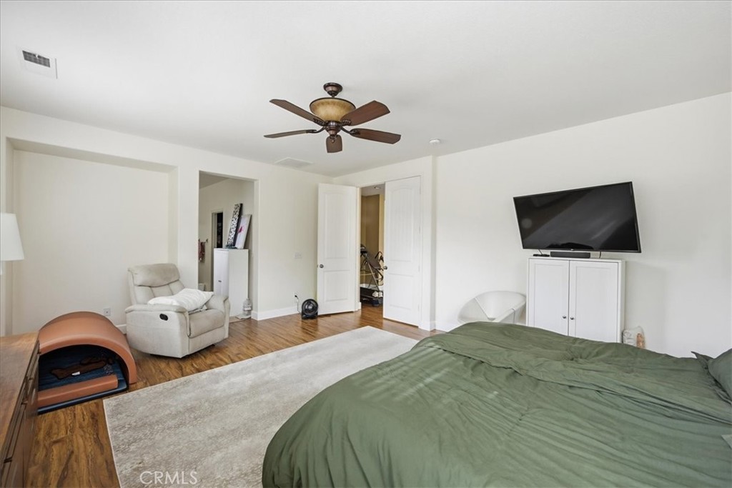 32623 Ritter Court Temecula, CA 92592 - Photo 27 of 40 a bedroom with a bed and a flat screen tv