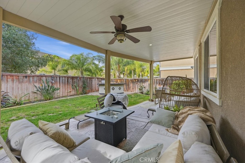 32623 Ritter Court Temecula, CA 92592 - Photo 37 of 40 a living room with patio furniture and a garden