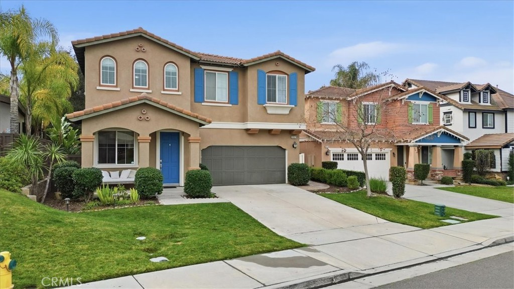 32623 Ritter Court Temecula, CA 92592 - Photo 4 of 40 a front view of a house with a yard and garage