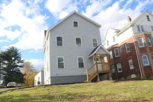 a view of a house with a yard