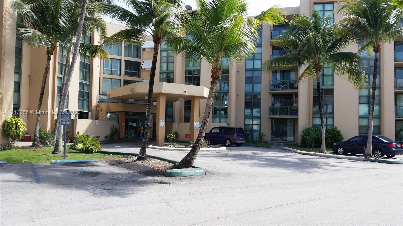 2075 Southwest 122nd Avenue, Unit 402 Miami, FL 33175 - Photo 2 of 36 a view of a building with palm trees