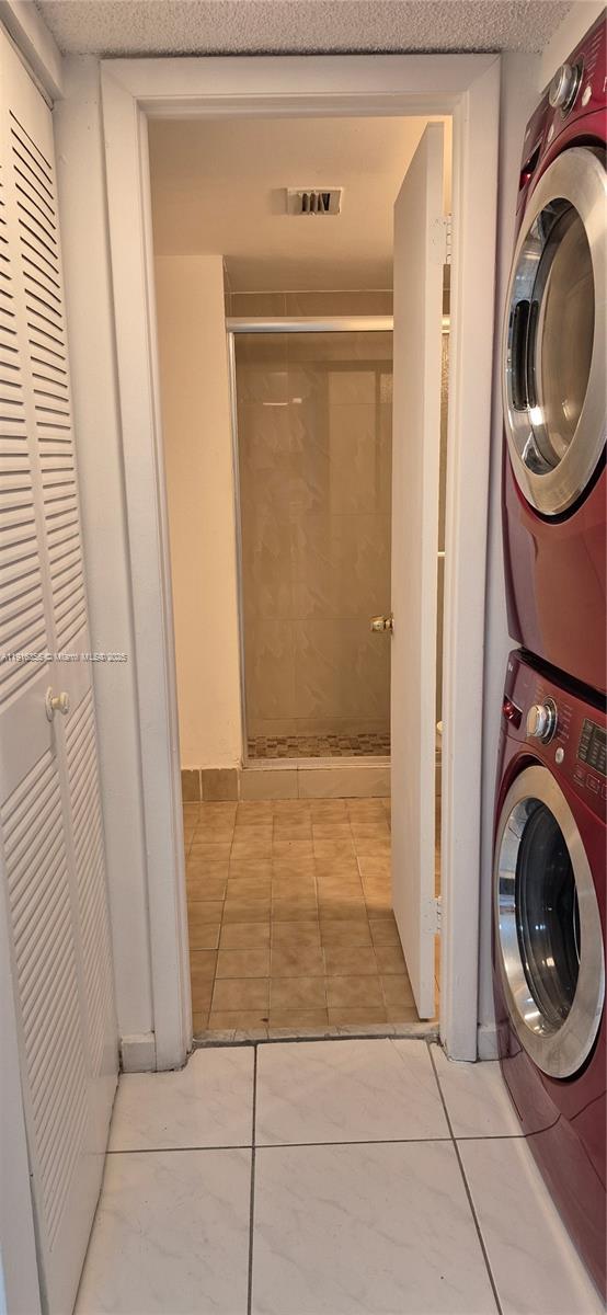 2075 Southwest 122nd Avenue, Unit 402 Miami, FL 33175 - Photo 28 of 36 a view of a hallway with washer and dryer