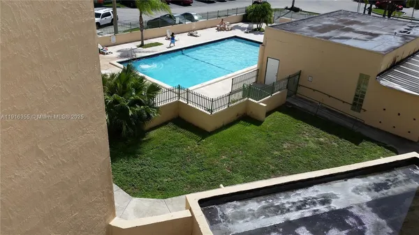 a view of a backyard with sitting area