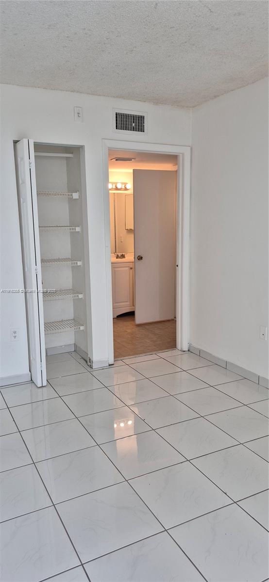 2075 Southwest 122nd Avenue, Unit 402 Miami, FL 33175 - Photo 35 of 36 a view of an empty room and closet area