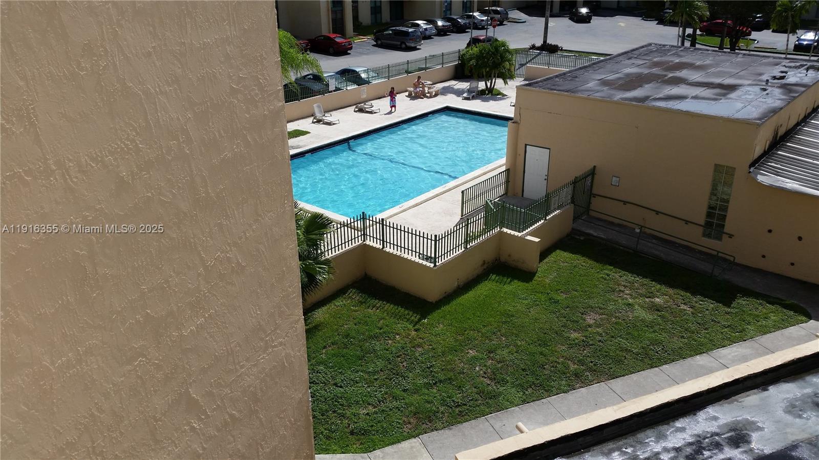 2075 Southwest 122nd Avenue, Unit 402 Miami, FL 33175 - Photo 4 of 36 a view of a house with a backyard porch and sitting area