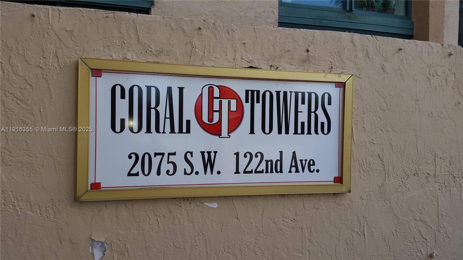 2075 Southwest 122nd Avenue, Unit 402 Miami, FL 33175 - Photo 6 of 36 a wall with a sign on it