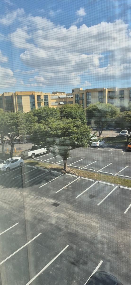 2075 Southwest 122nd Avenue, Unit 402 Miami, FL 33175 - Photo 9 of 36 a view of water with a building in the background