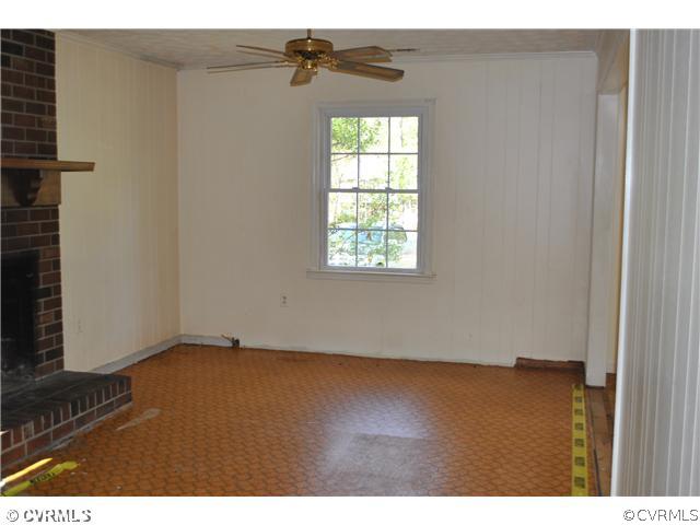 15211 Beach Road Chesterfield, VA 23838 - Photo 3 of 10 an empty room with wooden floor and windows