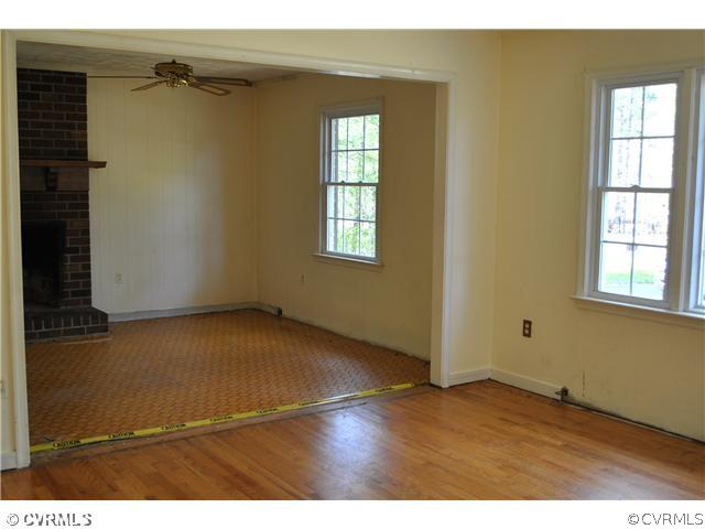 15211 Beach Road Chesterfield, VA 23838 - Photo 4 of 10 an empty room with wooden floor and windows