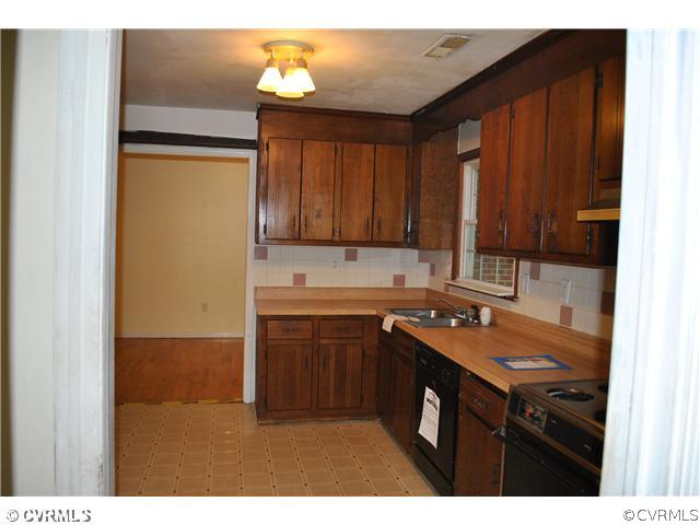 15211 Beach Road Chesterfield, VA 23838 - Photo 8 of 10 a kitchen with a sink and cabinets