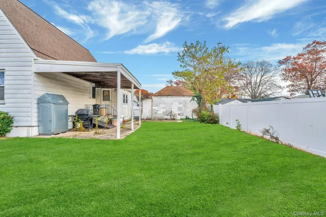 a view of a house with a yard porch and sitting area