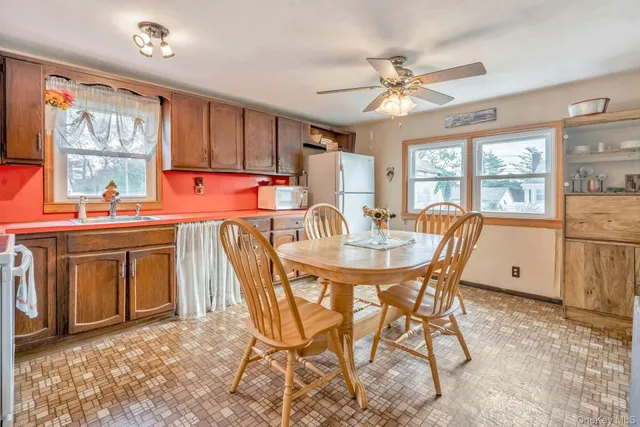 a dining room with furniture and window
