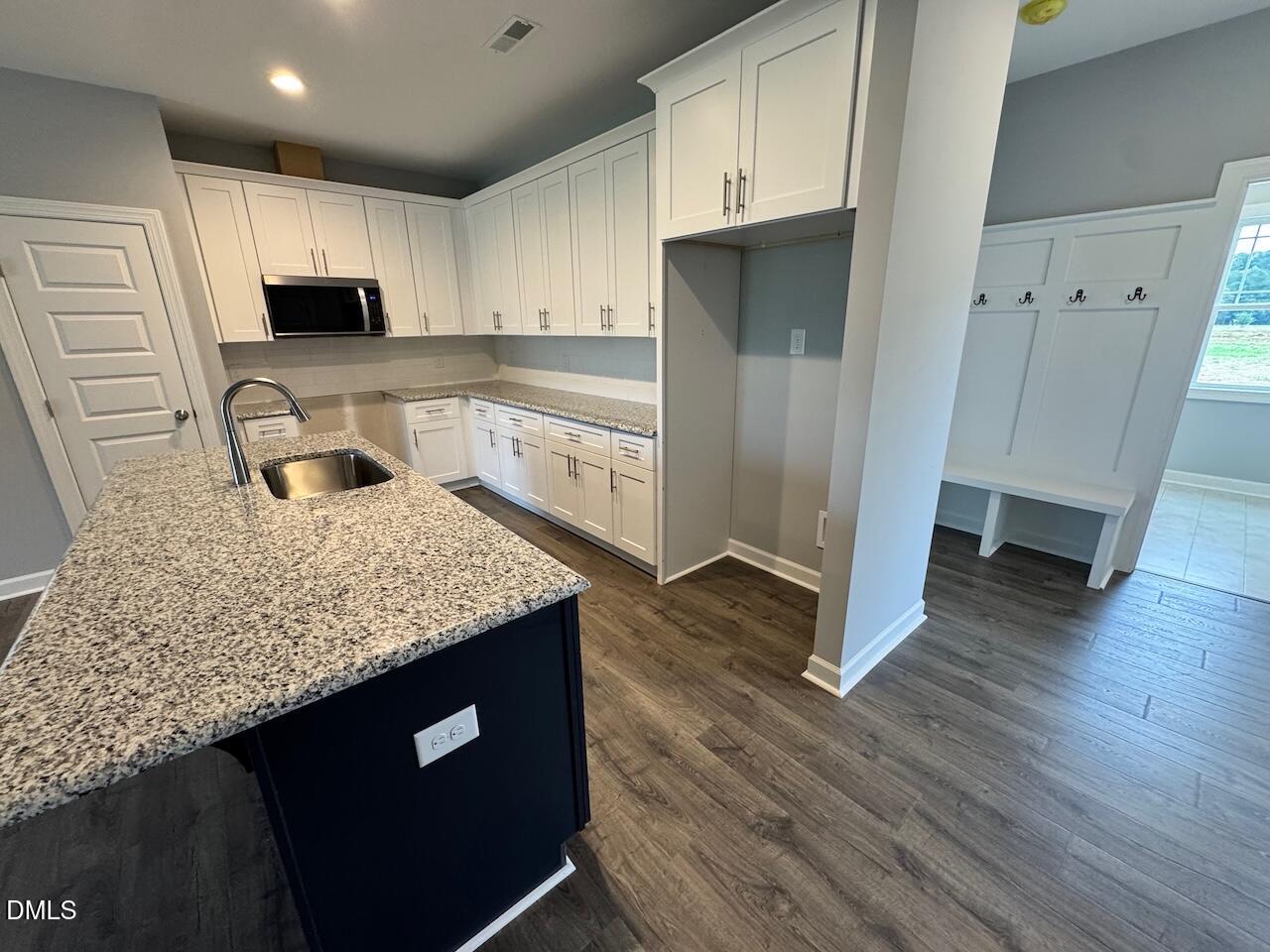 9 Alex Acres Way Selma, NC 27576 - Photo 12 of 26 a kitchen with stainless steel appliances granite countertop a sink stove and refrigerator