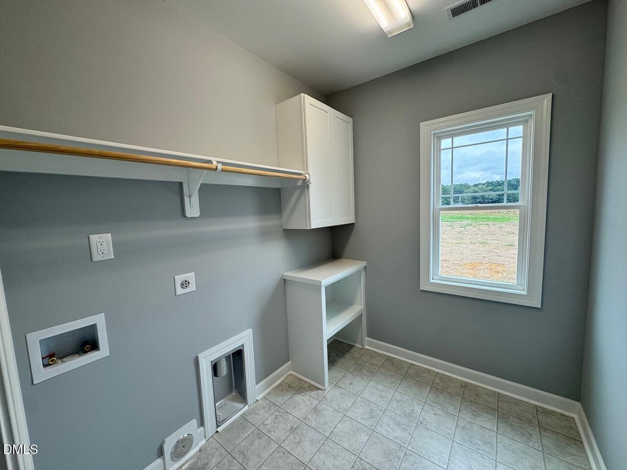 9 Alex Acres Way Selma, NC 27576 - Photo 14 of 26 a kitchen with a refrigerator and window