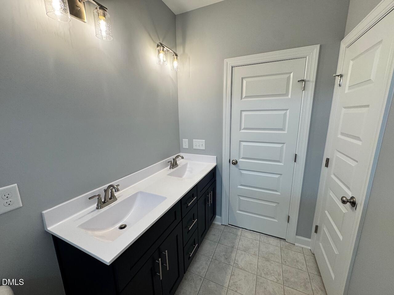 9 Alex Acres Way Selma, NC 27576 - Photo 17 of 26 a bathroom with a sink and a mirror