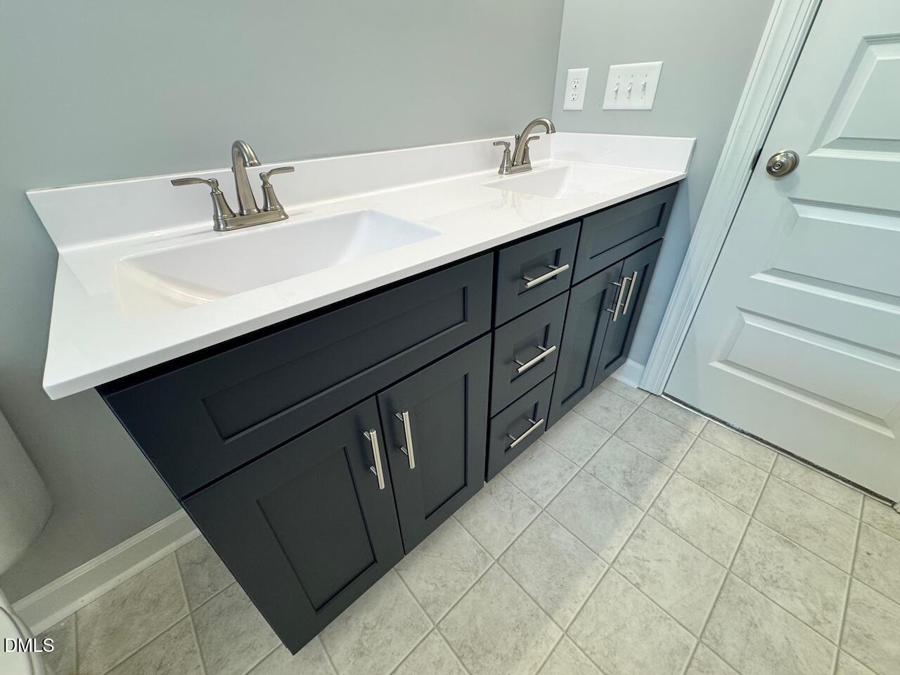 9 Alex Acres Way Selma, NC 27576 - Photo 18 of 26 a bathroom with a sink and a mirror