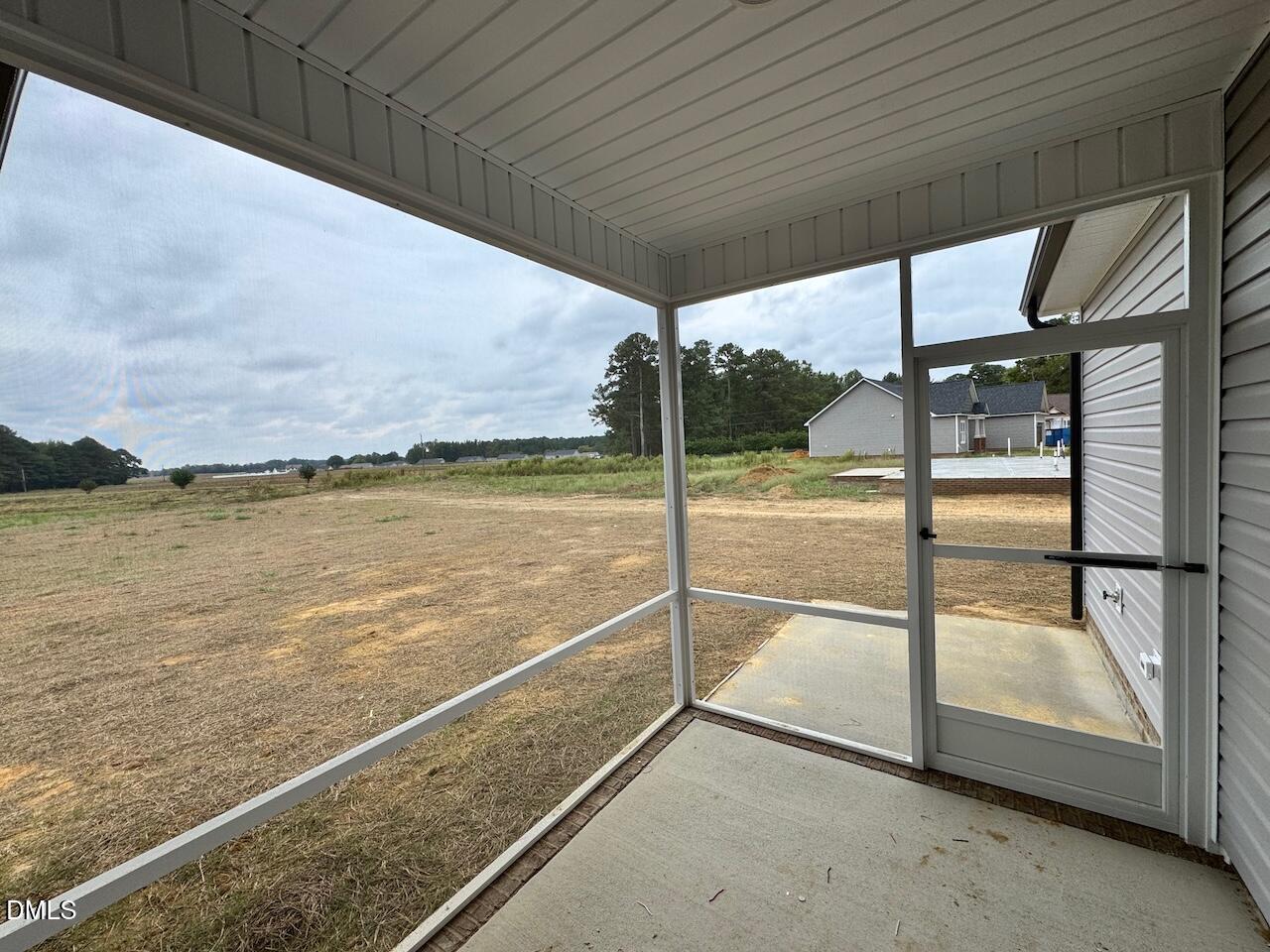 9 Alex Acres Way Selma, NC 27576 - Photo 19 of 26 a view of a floor to ceiling window next to a yard