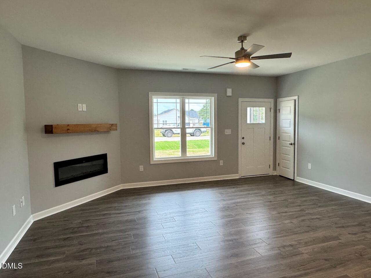 9 Alex Acres Way Selma, NC 27576 - Photo 2 of 26 a view of an empty room with glass door and wooden floor