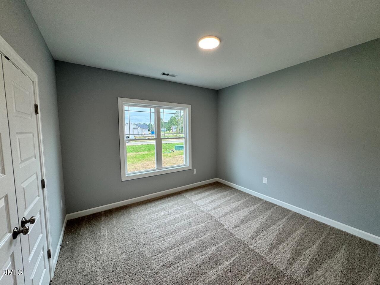 9 Alex Acres Way Selma, NC 27576 - Photo 22 of 26 a view of an empty room with a window