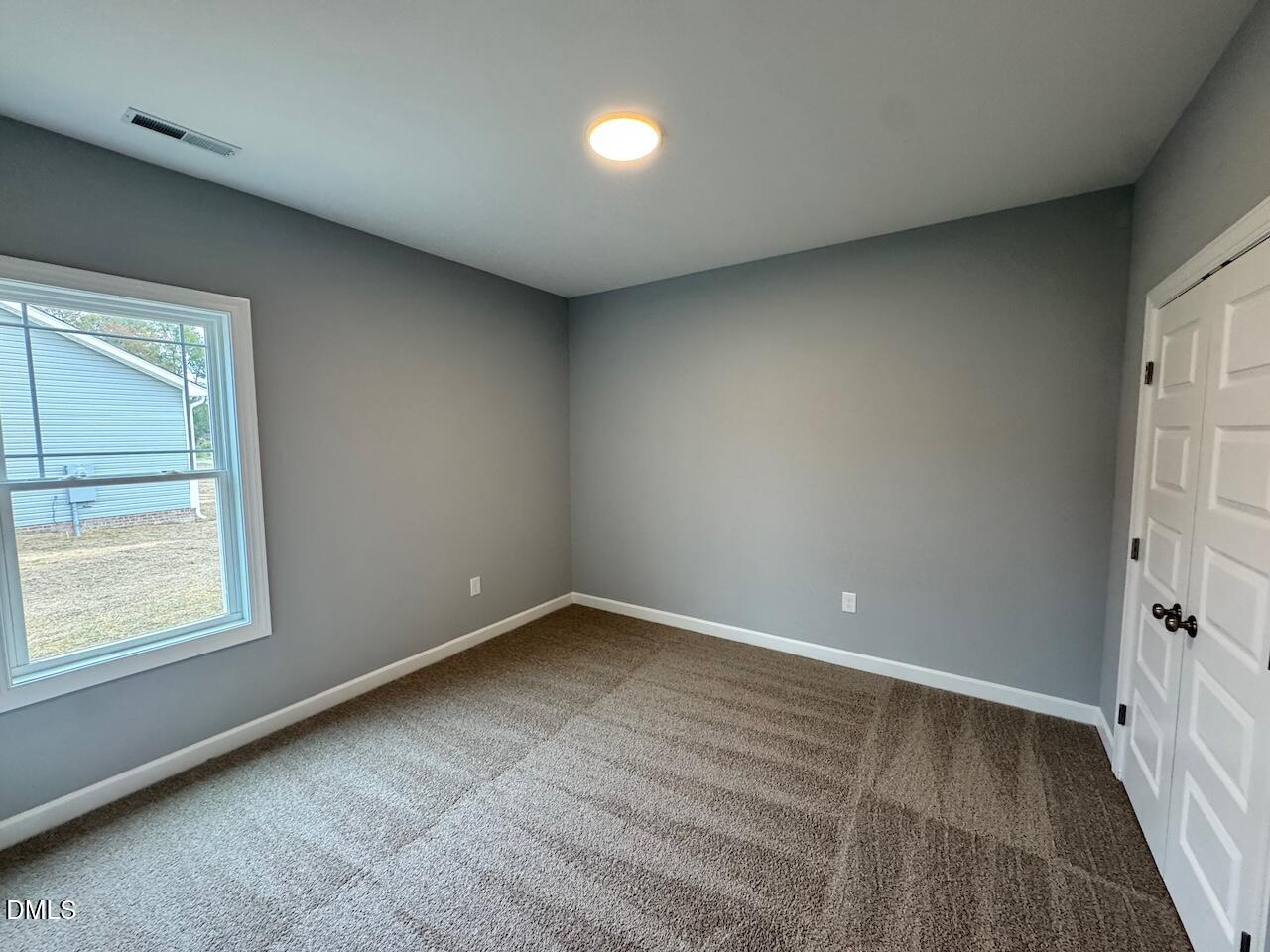 9 Alex Acres Way Selma, NC 27576 - Photo 23 of 26 an empty room with a window
