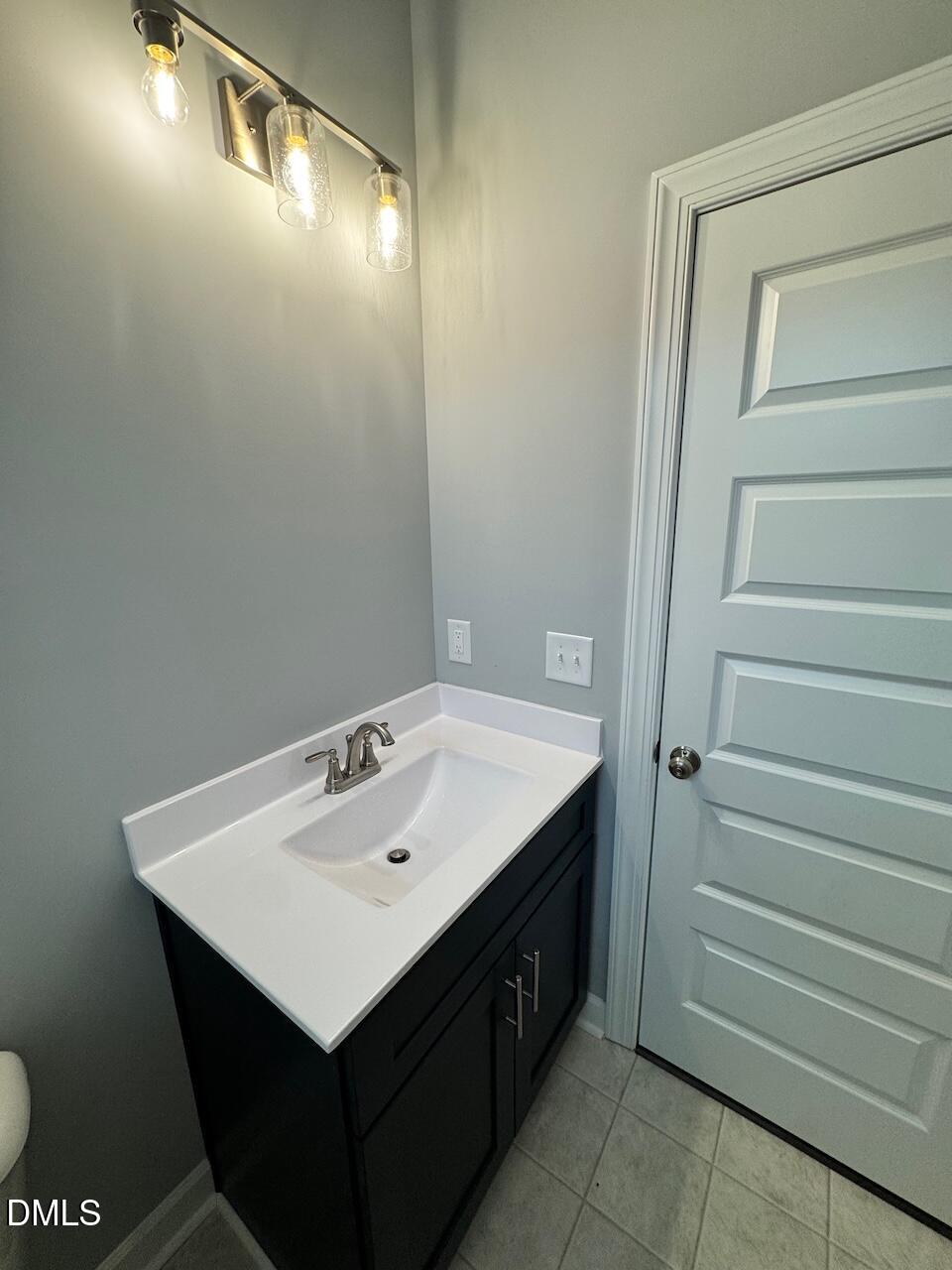 9 Alex Acres Way Selma, NC 27576 - Photo 25 of 26 a bathroom with a sink and a mirror