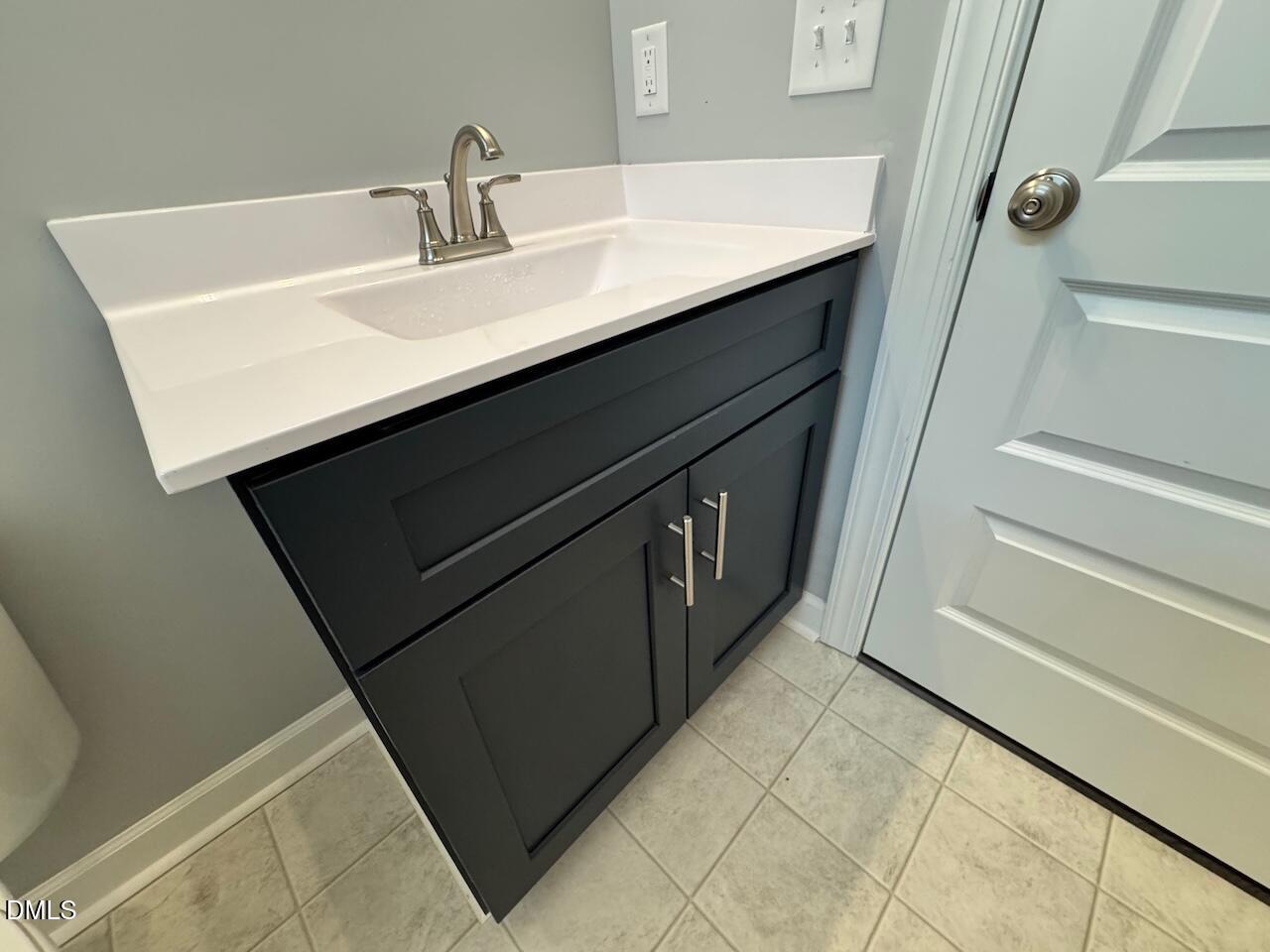9 Alex Acres Way Selma, NC 27576 - Photo 26 of 26 a bathroom with a sink and a mirror