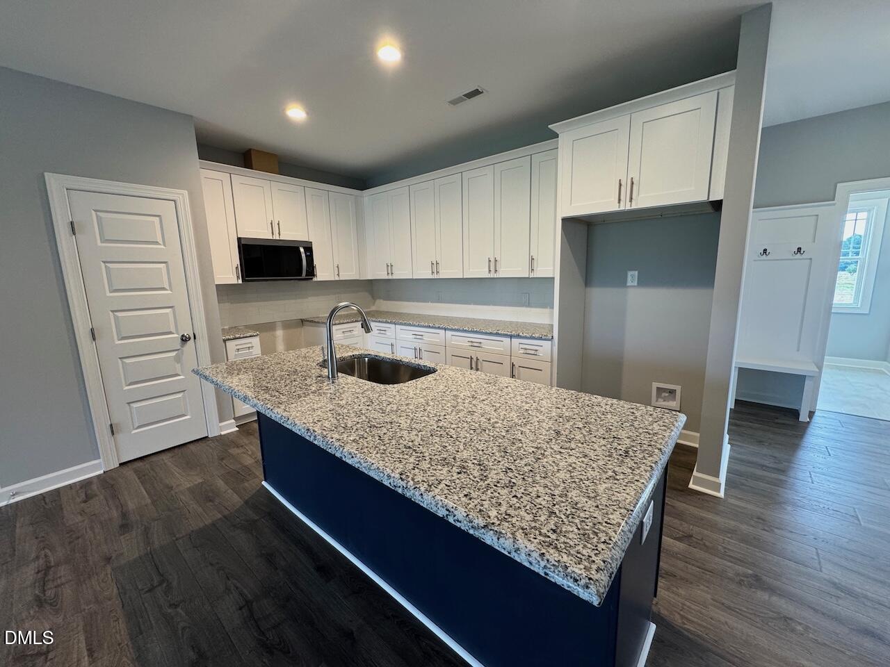 9 Alex Acres Way Selma, NC 27576 - Photo 7 of 26 a kitchen with kitchen island granite countertop a sink stove and refrigerator